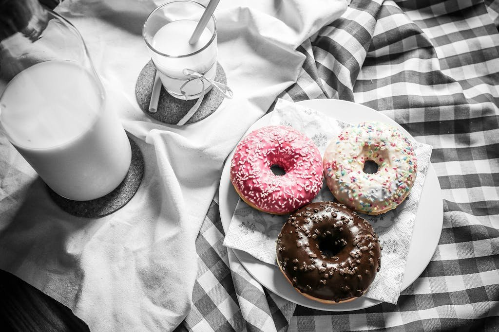 Doughnuts Near Milk on Plate