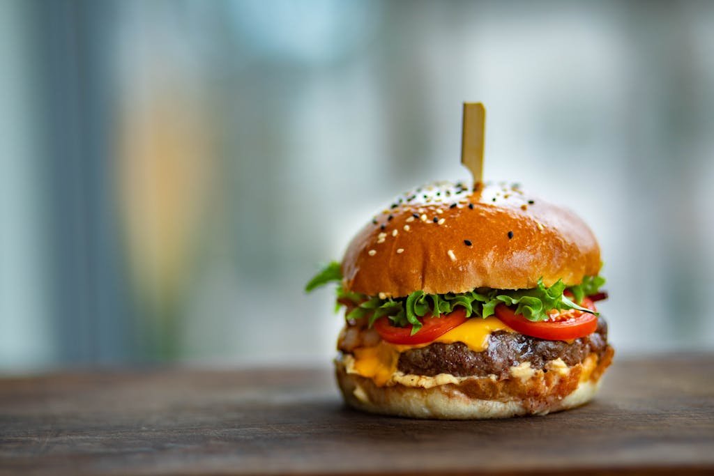 Photo of Juicy Burger on Wooden Surface