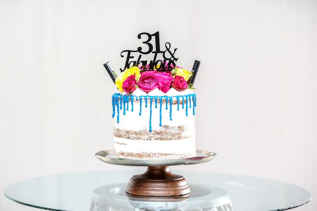 Baked Cake on Gray Cake Stand on Glass Table