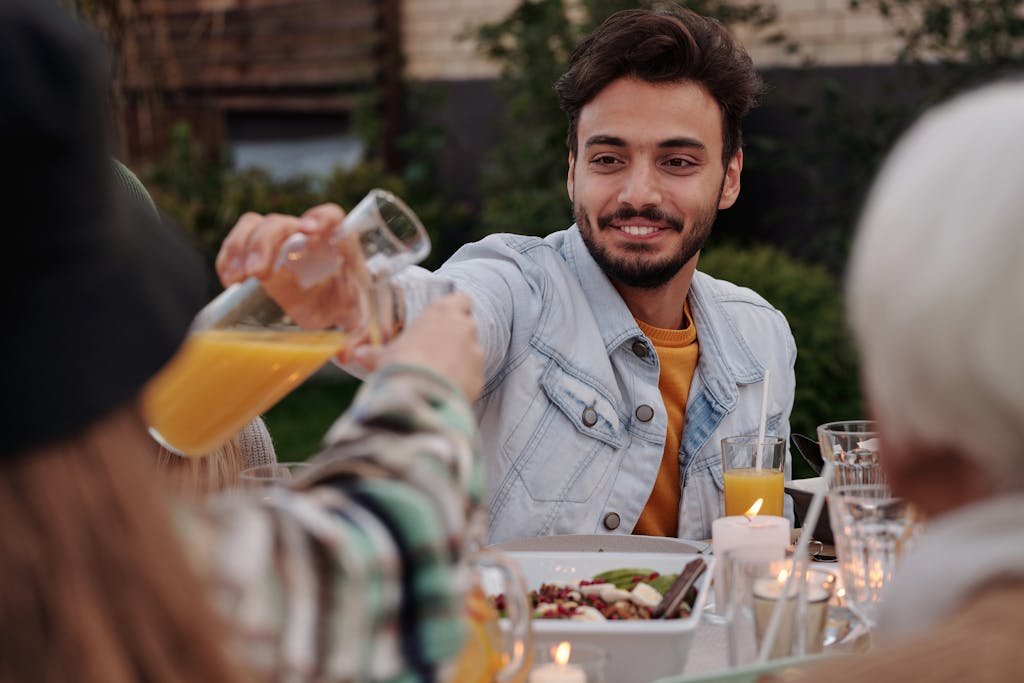 Cheerful man having dinner party with family