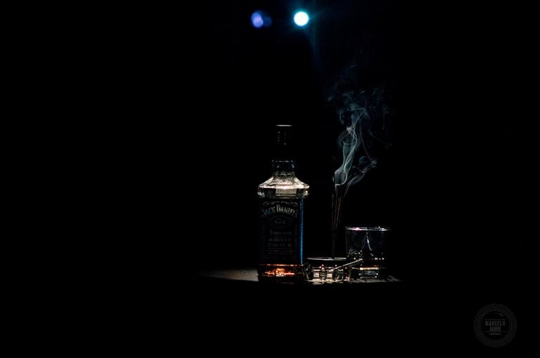 Closeup Photo of Liquor Bottle Against Black Background