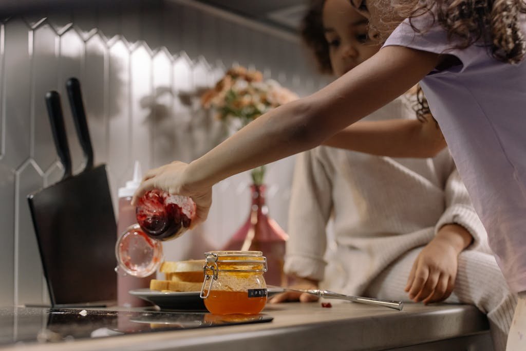 Little Girls Preparing Jam Sandwiches